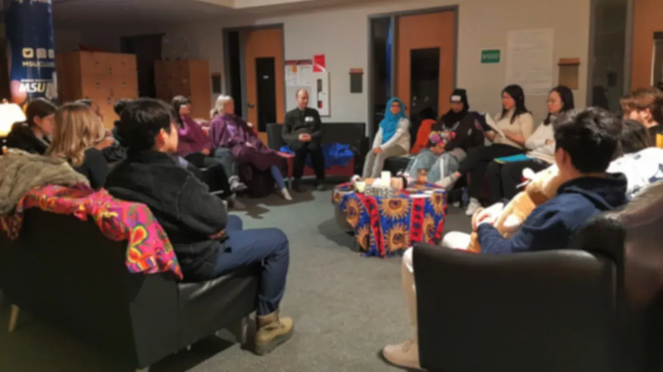 A large group of people in a circle